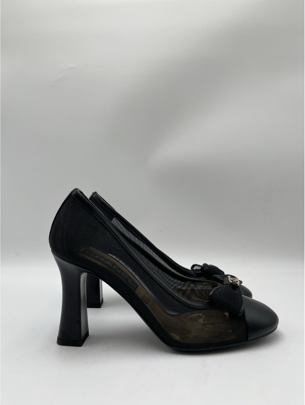Chanel 2023 black leather / mesh pumps with bow and crystal CC logo Size 37.5